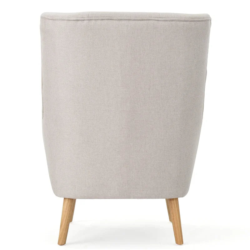 Moderna Poltrona a Orecchioni con Schienale Alto 32.5, Rivestita e Capitonnè, con Gambe in Legno di Caucciù