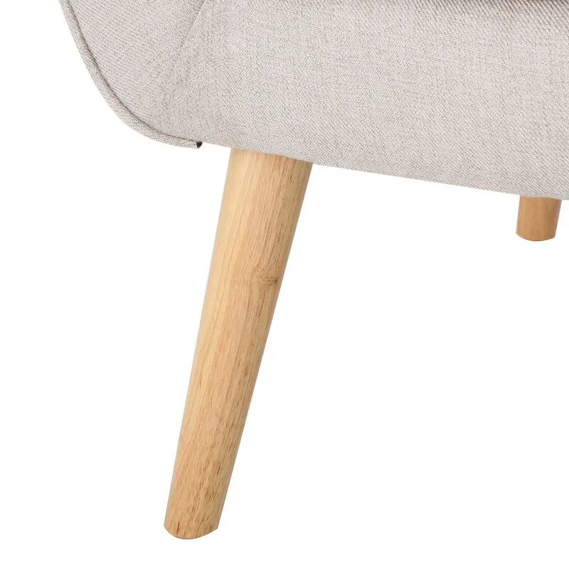 Moderna Poltrona a Orecchioni con Schienale Alto 32.5, Rivestita e Capitonnè, con Gambe in Legno di Caucciù