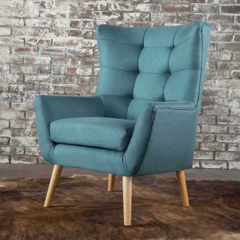 Moderna Poltrona a Orecchioni con Schienale Alto 32.5, Rivestita e Capitonnè, con Gambe in Legno di Caucciù