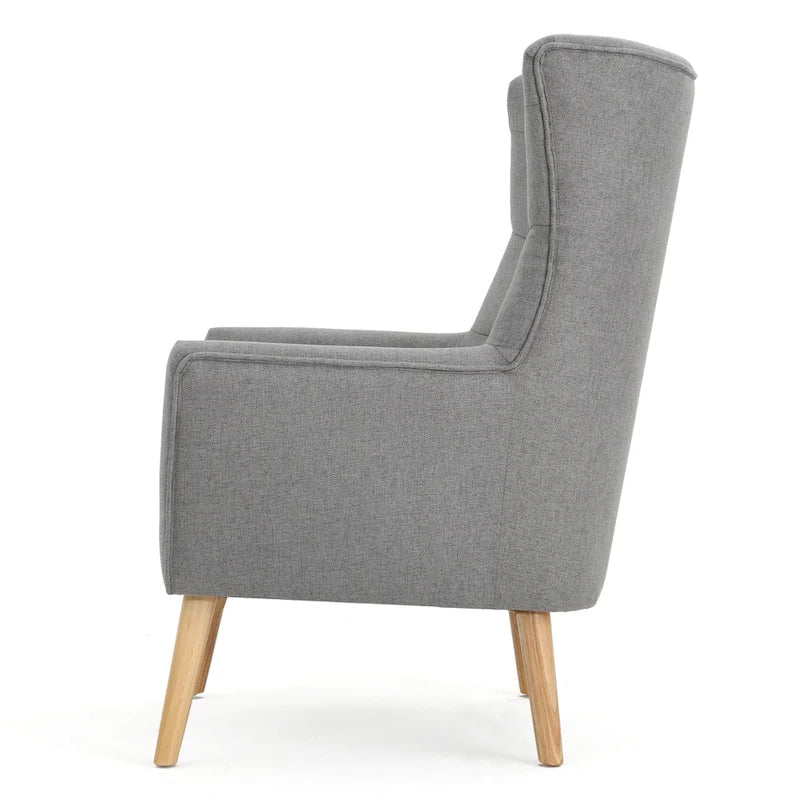 Moderna Poltrona a Orecchioni con Schienale Alto 32.5, Rivestita e Capitonnè, con Gambe in Legno di Caucciù