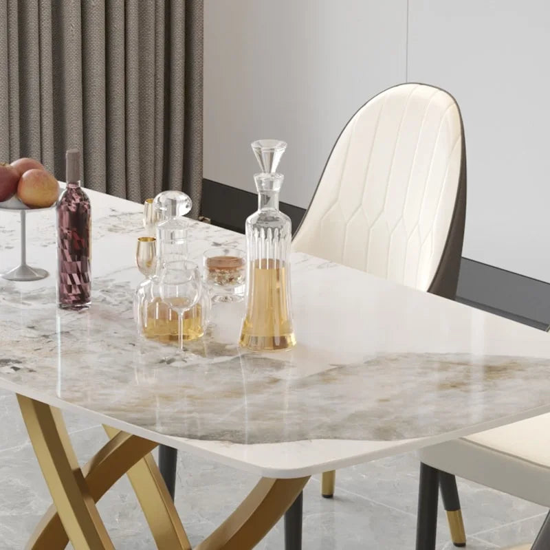 Tavolo da pranzo moderno con piano rettangolare in pietra sinterizzata e base dorata